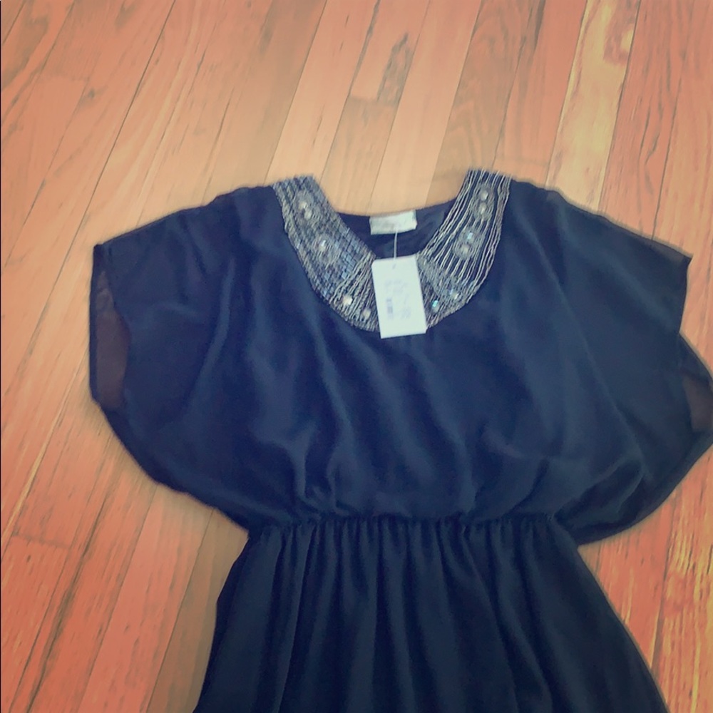 Flowy black chiffon like cocktail mini dress.